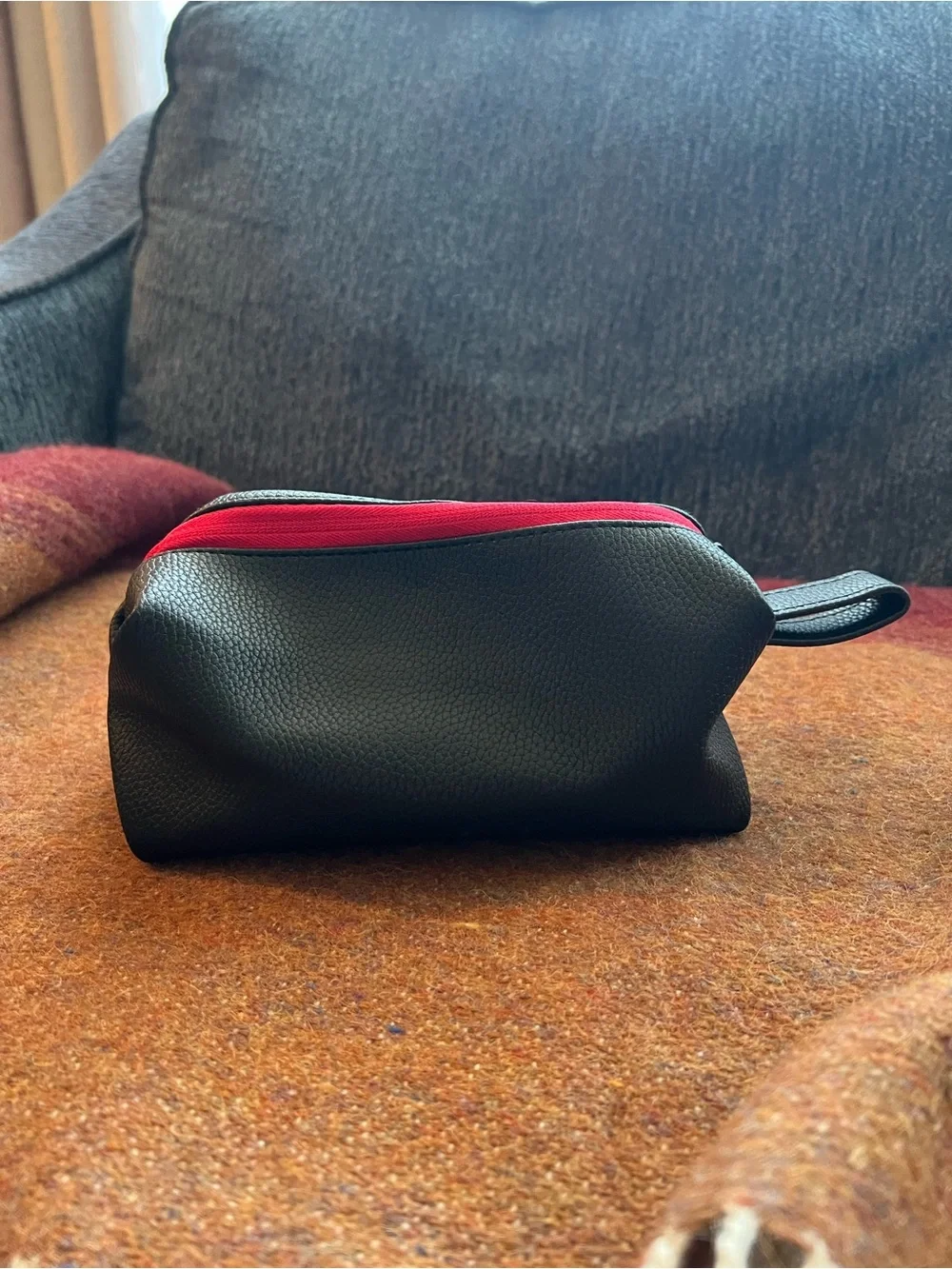 Tumi El Al Business Class Amenity Kit, featuring a black pebbled exterior